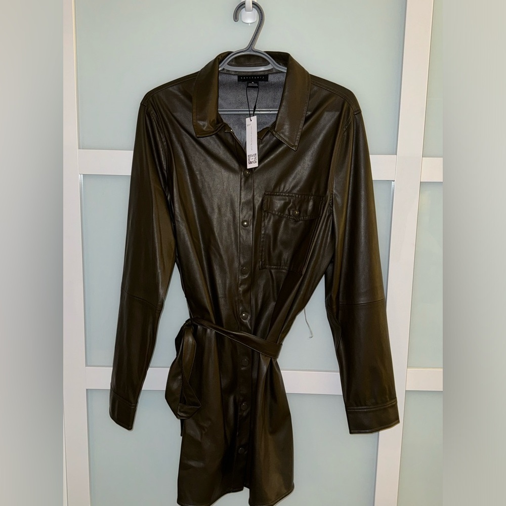 Faux leather dress.  Brand new, with tags. Color: Brown